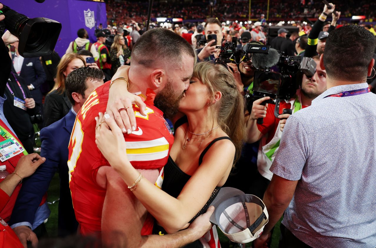 Travis Kelce and Taylor Swift embrace after the Chiefs’ win in Super Bowl LVIII. EZRA SHAW/GETTY IMAGES