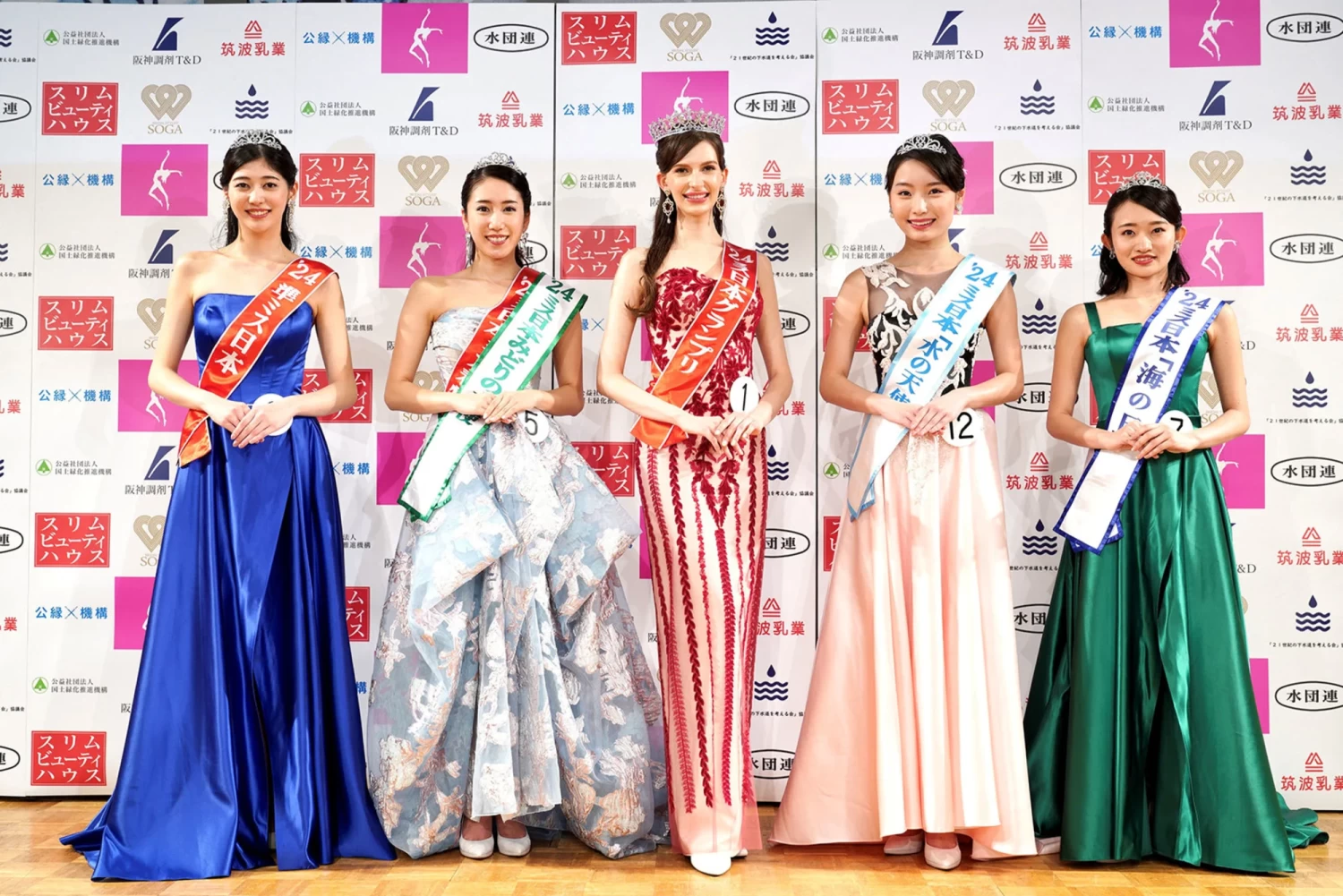 Karolina Shiino (center), poses with other prize winners at the Miss Nippon contest in Tokyo on January 22, 2024. She has since relinquished her title. Miss Japan Association/Handout via Reuters