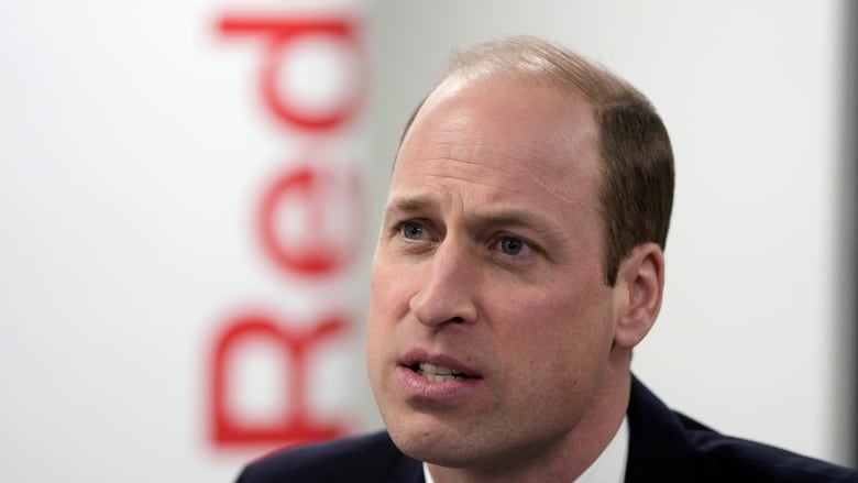 Prince William listens as he visits the British Red Cross at its headquarters in London, England, on Tuesday. (Kin Cheung/The Associated Press)
