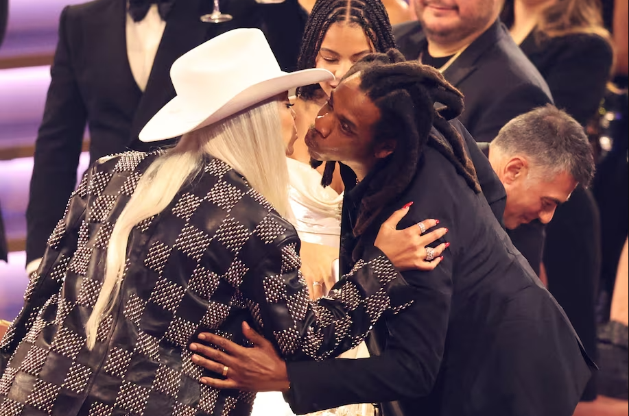 Jay-Z kisses Beyoncé on Sunday. (Mike Blake/Reuters)