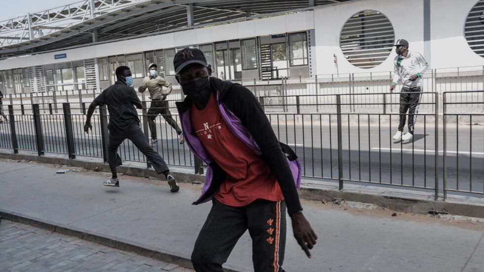 Protestors react during clashes with police in Dakar on February 9, 2024. © Guy Peterson, AFP