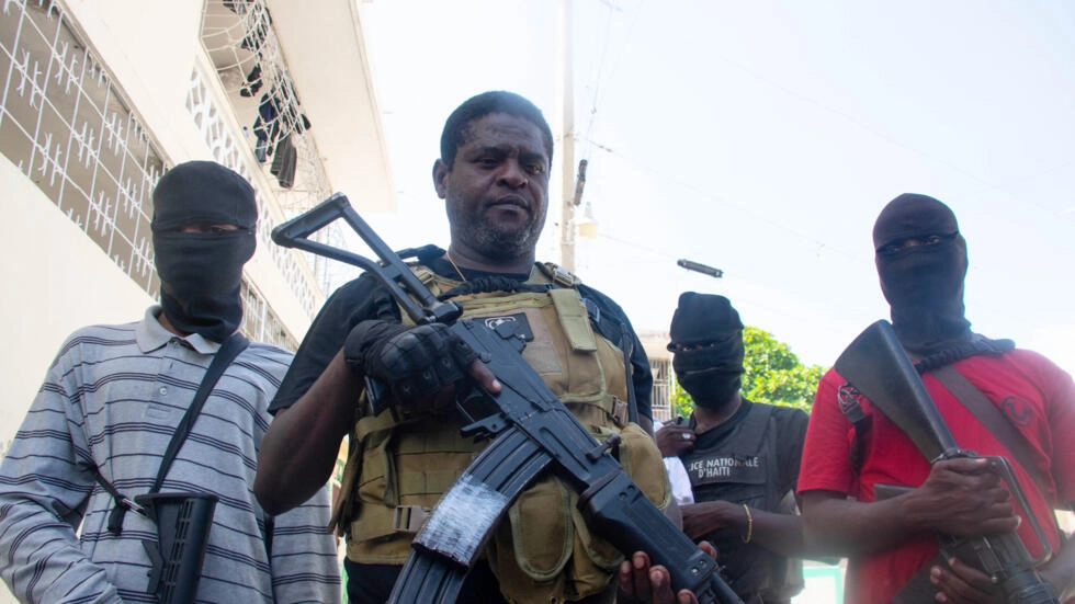 Armed gang leader Jimmy "Barbecue" Cherizier and his men are seen in Port-au-Prince, Haiti, on March 5, 2024. © Clarens Siffroy, AFP
