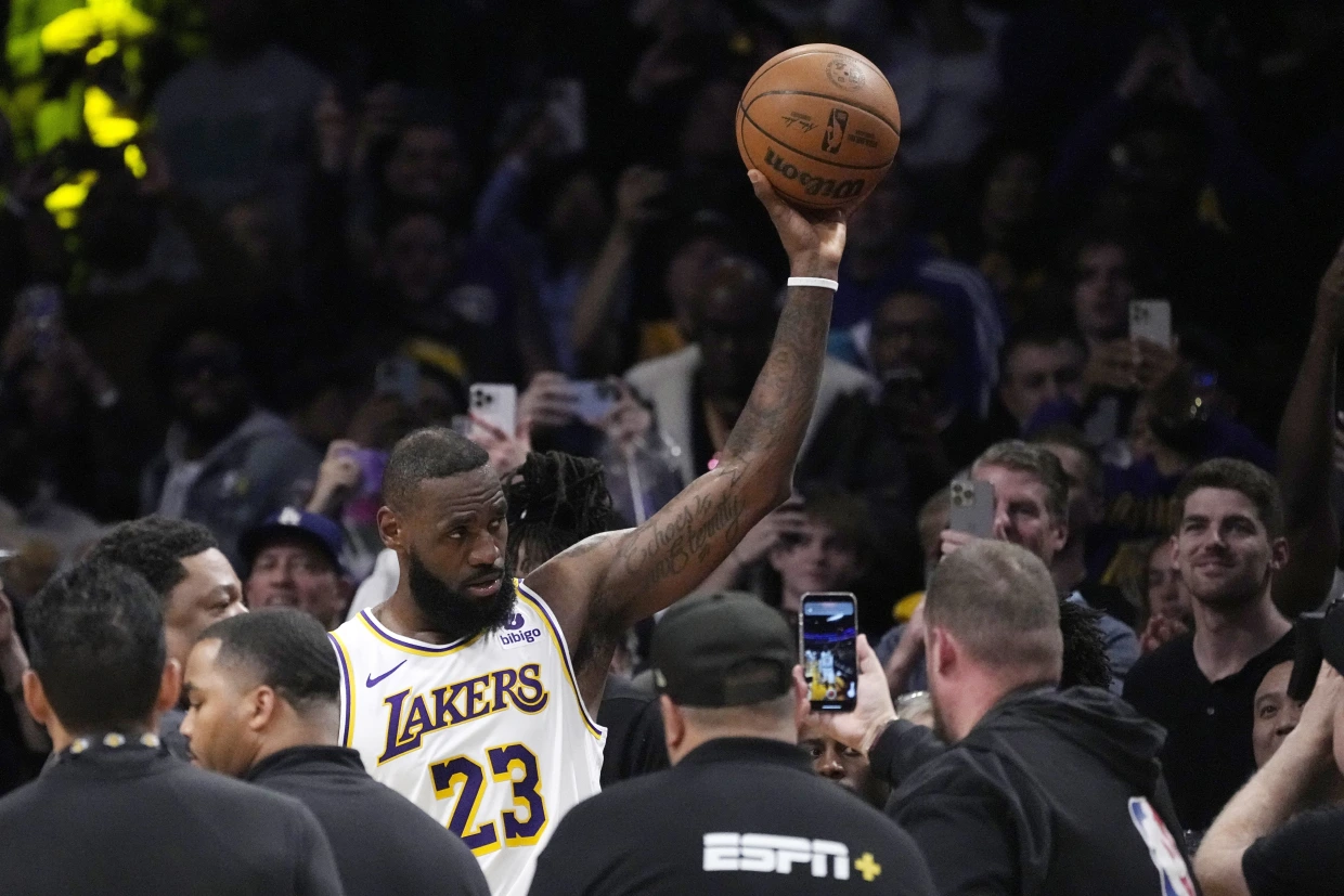 Los Angeles Lakers forward LeBron James acknowledges fans after scoring to become the first NBA player to reach 40,000 points in a career during the first half of an NBA basketball game Saturday, March 2, 2024, in Los Angeles.Mark J. Terrill / AP
