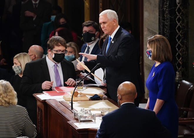 Vice President Mike Pence and House Speaker Nancy Pelosi preside over the certification of Electoral College votes at the Capitol on Jan. 6, 2021. Kevin Dietsch/Pool Photo