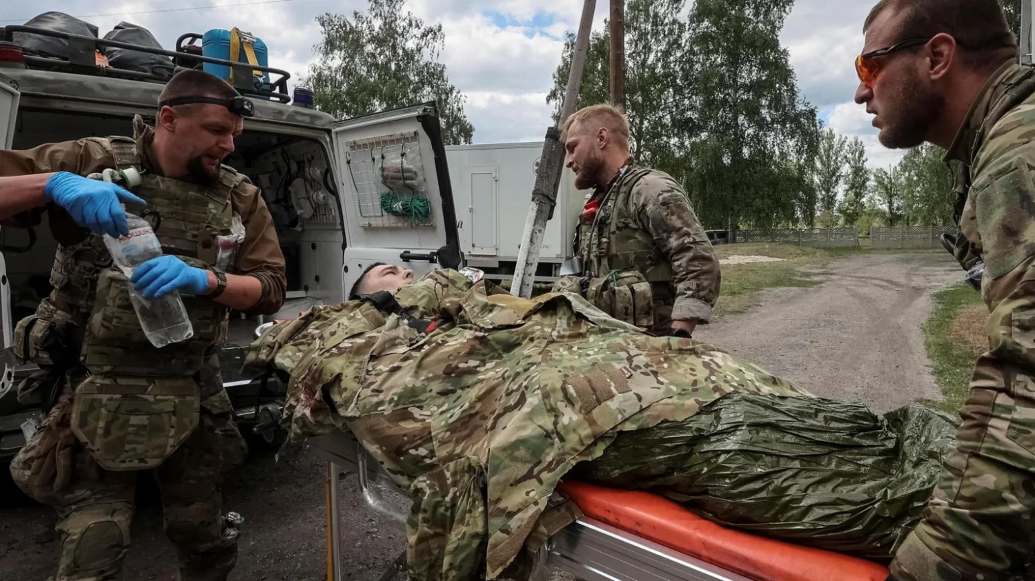 Military paramedics treat a wounded Ukrainian service member, amid Russia's attack on Ukraine, near the town of Vovchansk. Reuters