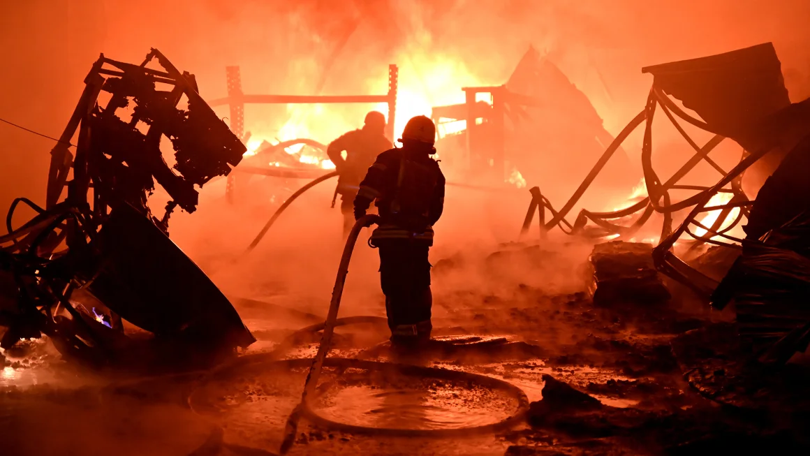 Ukrainian firefighters work to extinguish flames at the site of a drone attack on industrial facilities in Kharkiv on May 4. Sergey Bobok/AFP/Getty Images