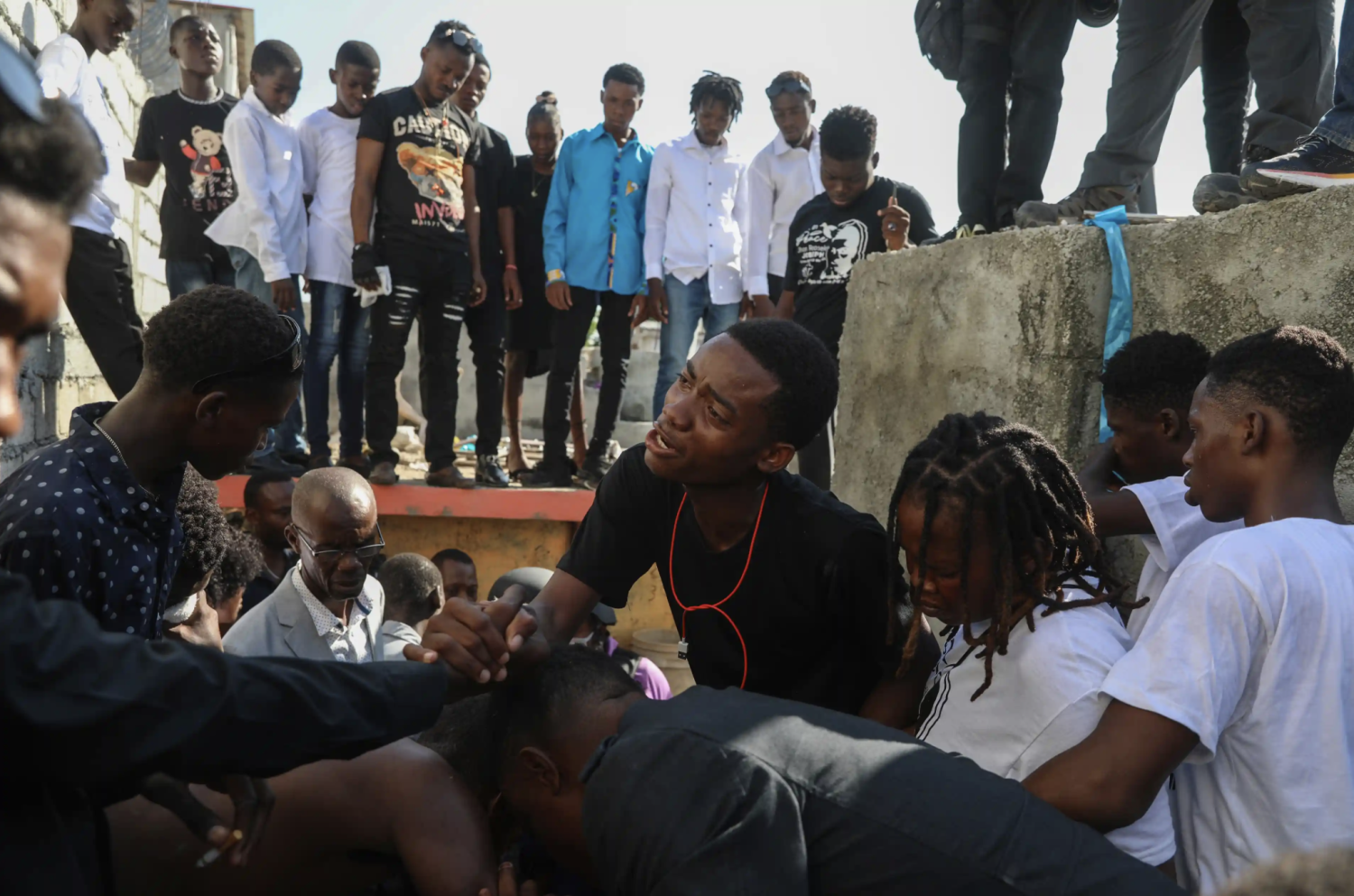 grieve the death of a teenager killed by a stray bullet during clashes between police and gang members in Port-au-Prince, Haiti, on Saturday. Photograph: Odelyn Joseph/AP