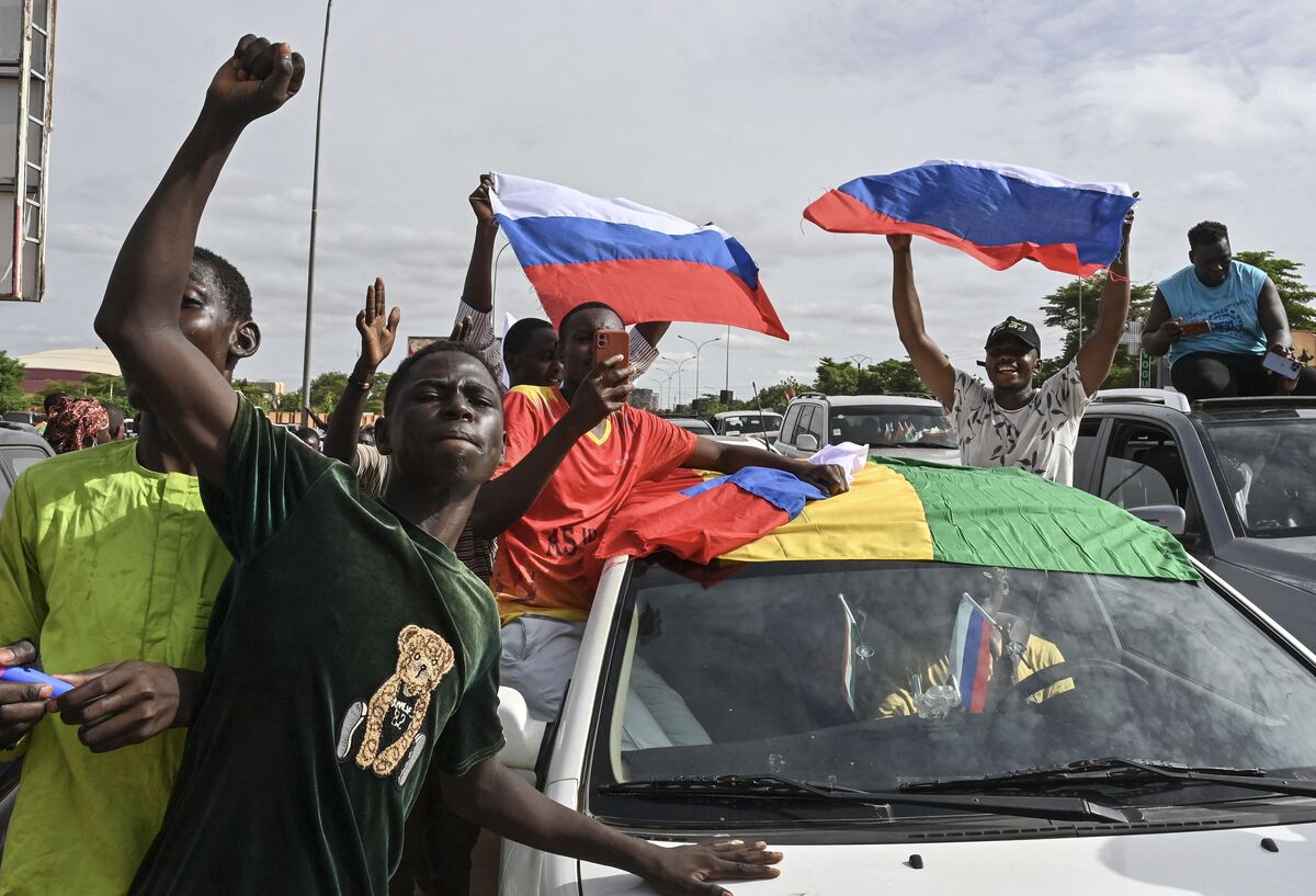 Coup supporters wave Russian flags in Niamey, Niger, in August 2023.Source: AFP/Getty Images