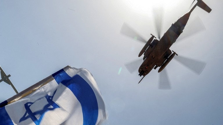 An Israeli air force CH-53 Sea Stallion military helicopter flies over Sheba Tel-HaShomer Medical Centre in Ramat Gan, Israel, June 8, 2024 ©  AFP / Jack Guez