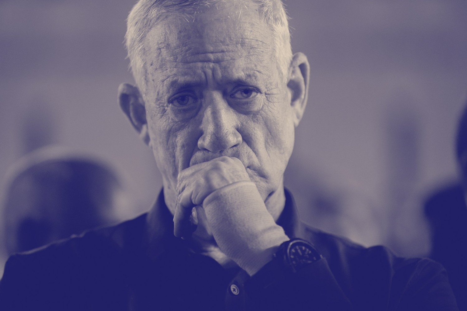 Benny Gantz with a hand on his mouth. Benny Gantz at a memorial event in Jersualem.Source photograph by Alexi J. Rosenfeld / Getty