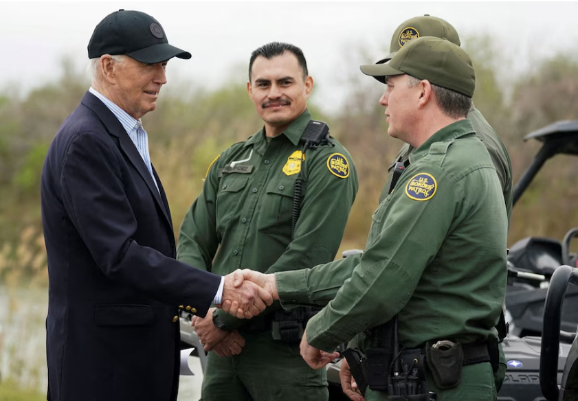 President Biden greets members of the U.S. Border Patrol at the U.S.-Mexico border in Brownsville, Tex., on Feb. 29. (Kevin Lamarque/Reuters)