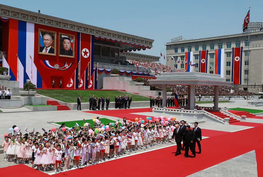 Russian President Vladimir Putin and North Korean leader Kim Jong Un attend a welcome ceremony at Kim Il Sung Square in Pyongyang on Wednesday. (Vladimir Smirnov/Sputnik/Pool/Reuters)
