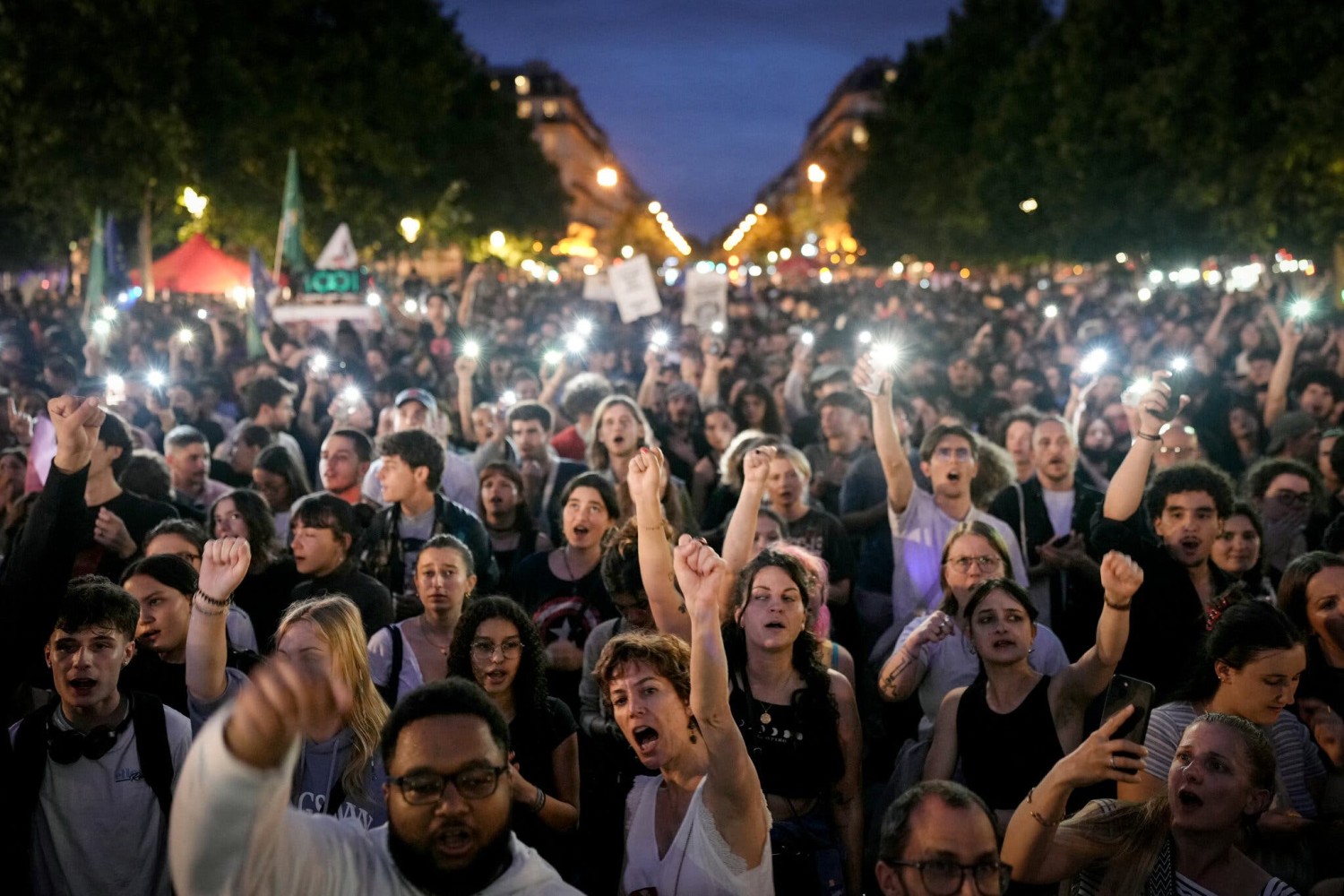 Demonstrators at a rally after the announcement of the results of the first round of French parliamentary elections at the Place de la République in Paris on Sunday.Credit...Dimitar Dilkoff/Agence France-Presse — Getty Images
