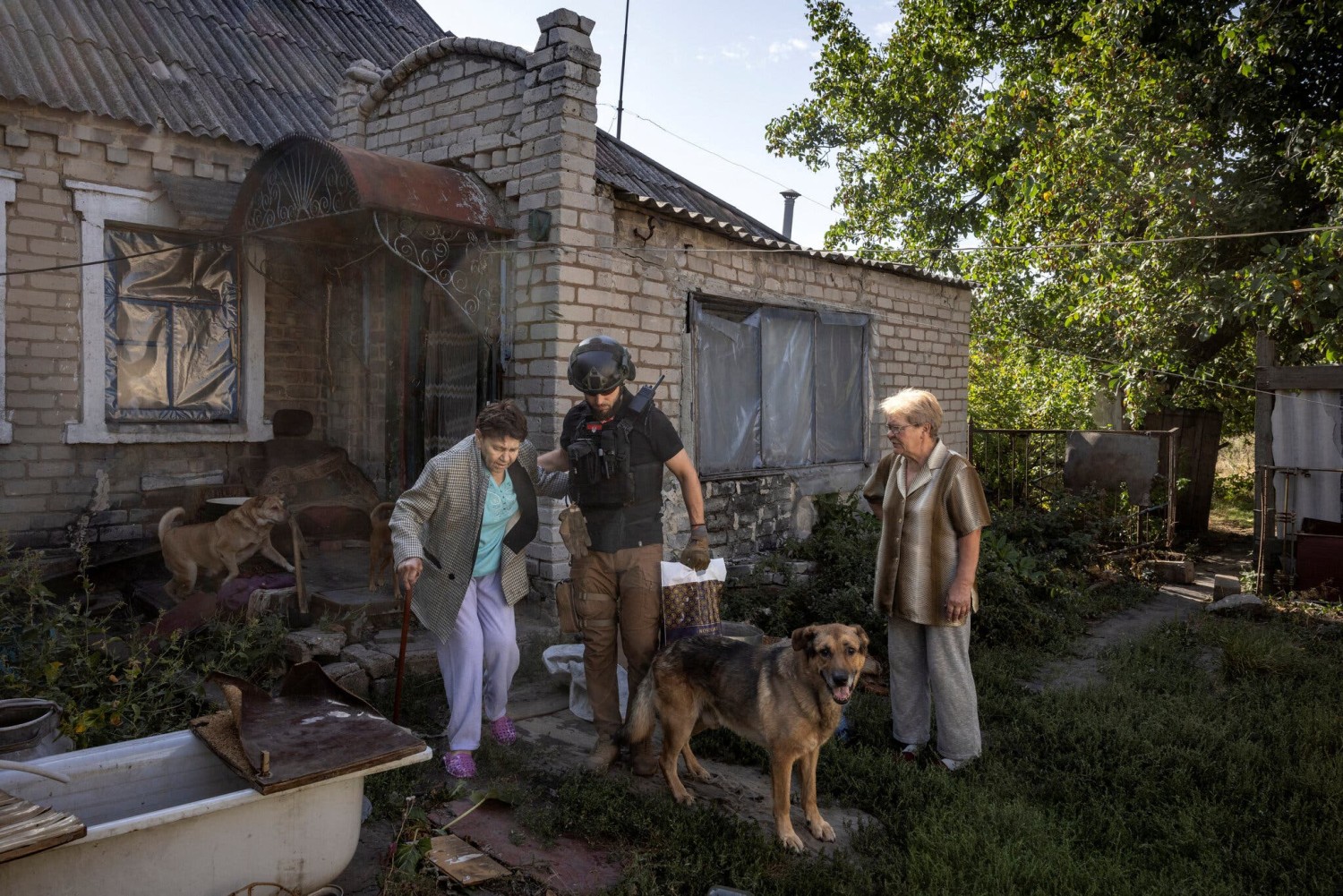 A volunteer helping residents evacuate on Thursday from a village near Pokrovsk, eastern Ukraine, as Russian forces grind toward the city.Credit...Thomas Peter/Reuters