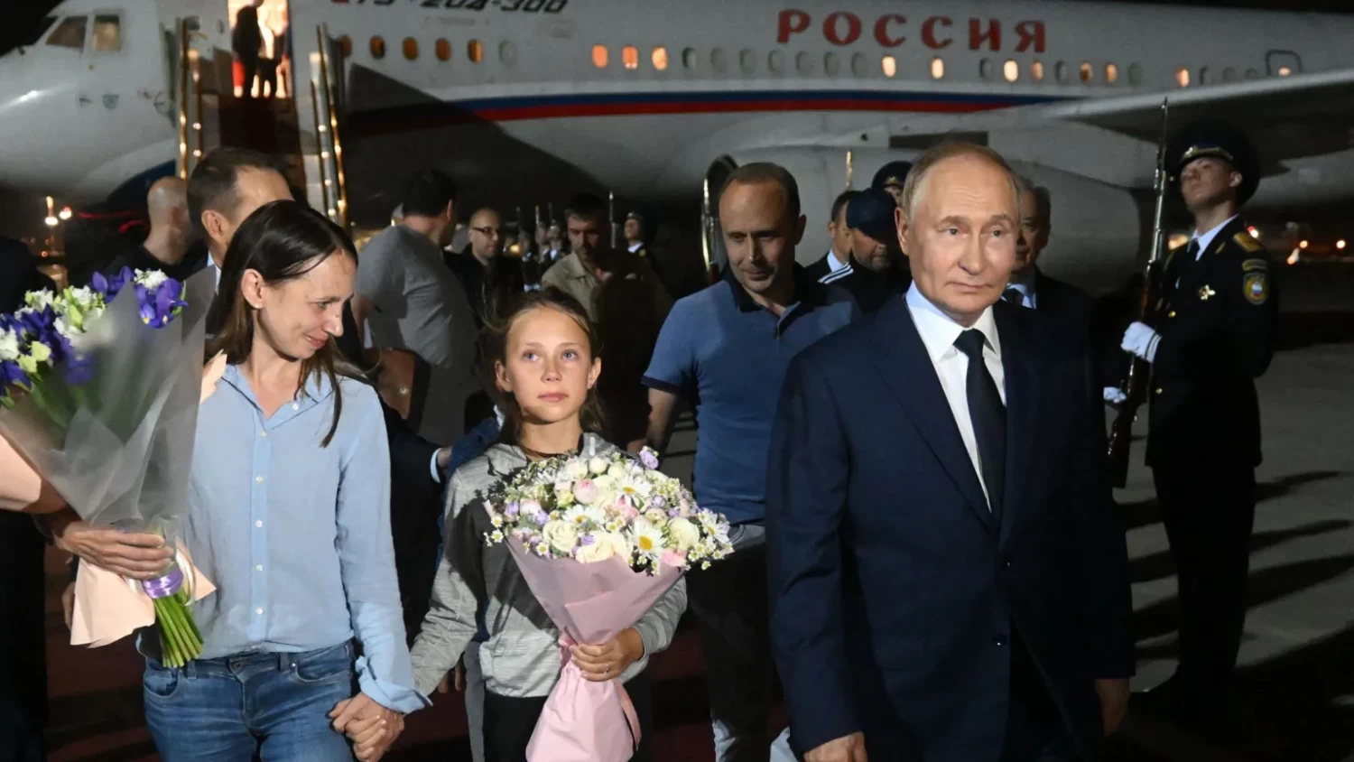 Russians returning home included two children /  EPA