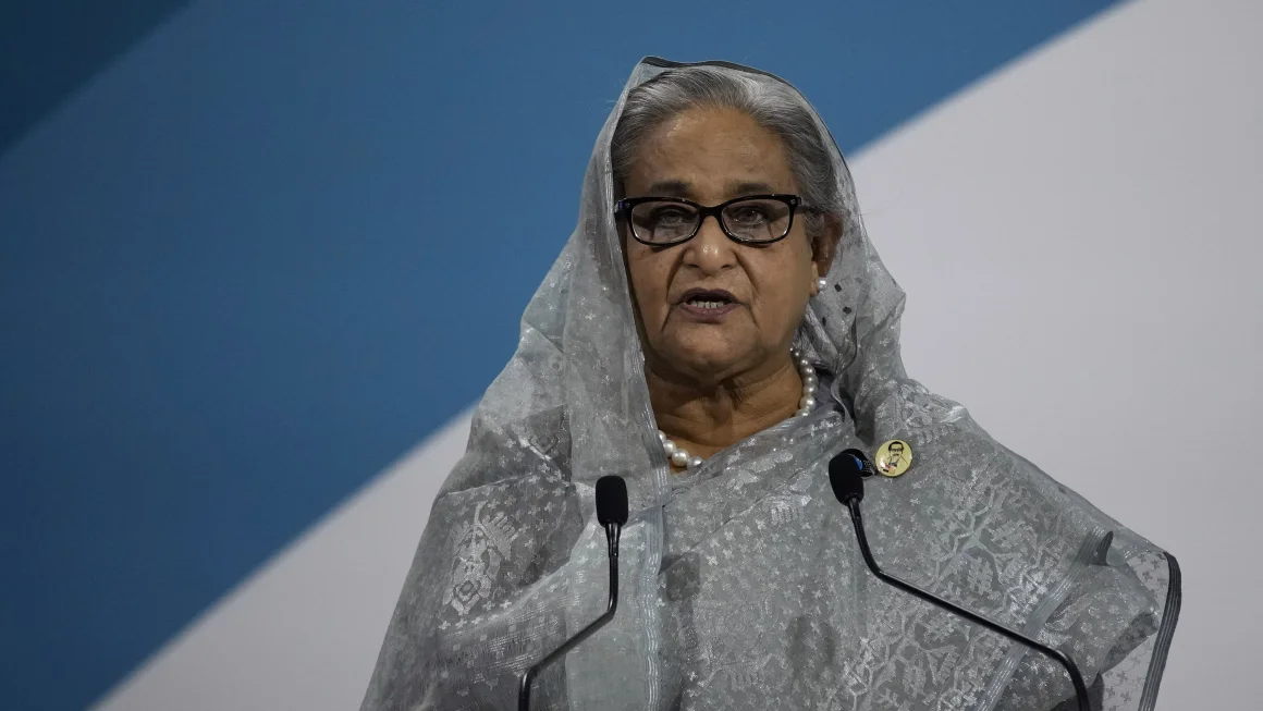 Crowds of protesters on Monday stormed the official residence of Bangladesh's Prime Minister Sheikh Hasina, pictured in November 2021. Christophe Ena/AP