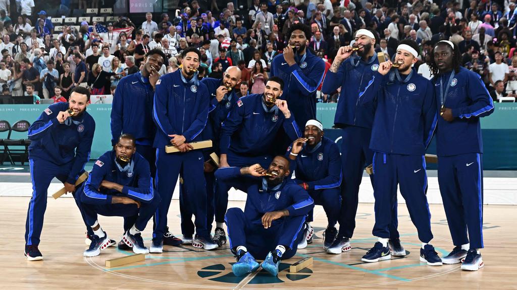 Team USA celebrating its latest gold medal. (Photo by Aris MESSINIS / AFP)