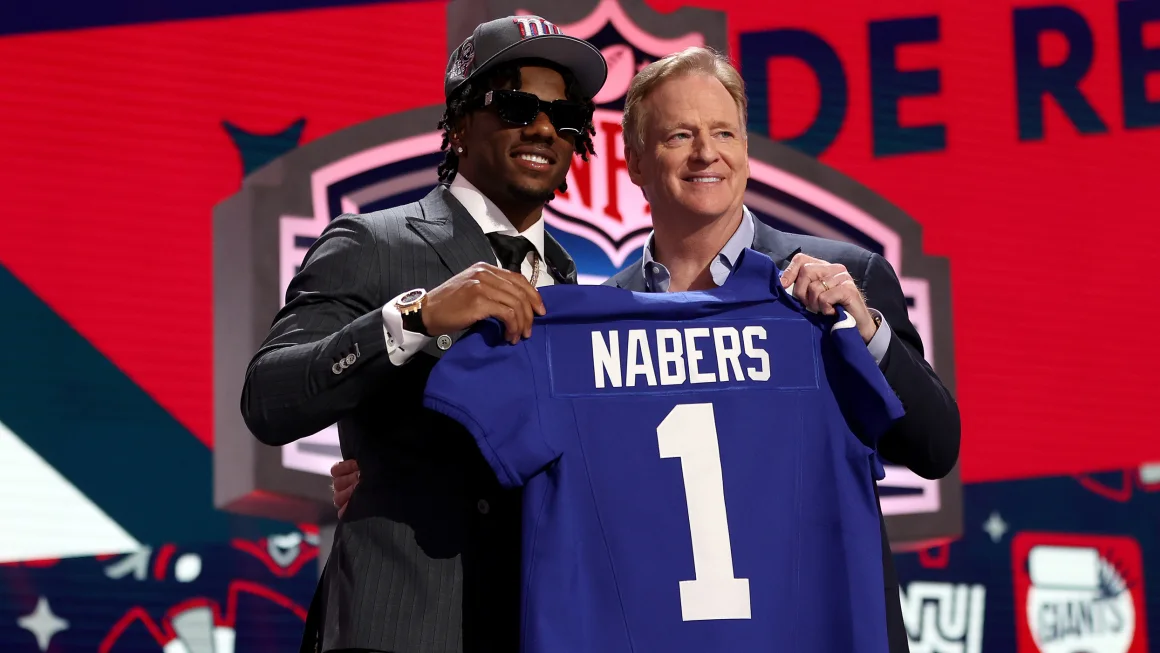 Nabers poses with NFL Commissioner Roger Goodell after being selected sixth overall by the New York Giants. Gregory Shamus/Getty Images