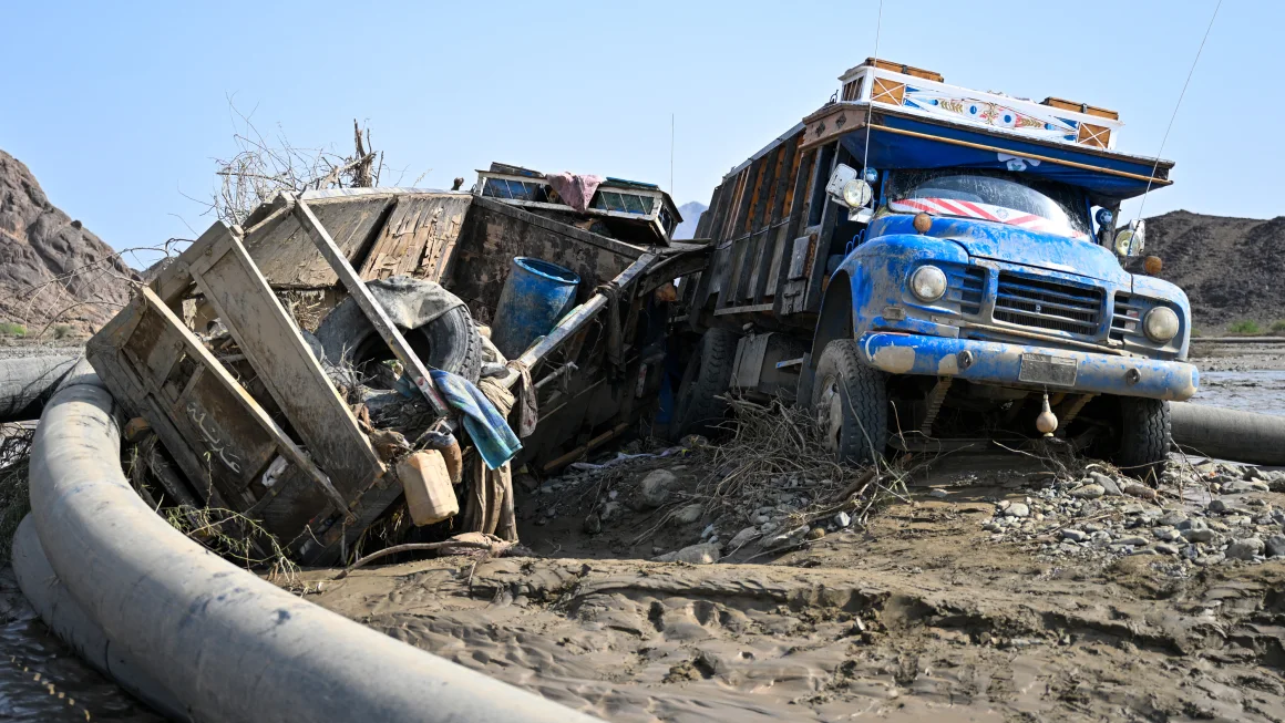 Damaged trucks buried in the mud after the collapse of the Arbaat Dam, 40km north of Port Sudan following heavy rains and torrential floods on August 25, 2024. AFP/Getty Images