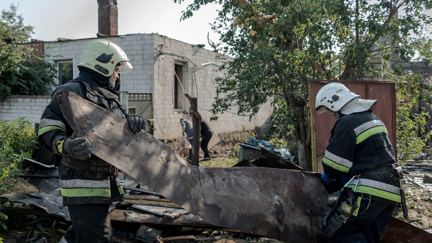 Rescue workers remove rubble at the site of a Russian missile strike in Kharkiv's Slobidskyi district on August 25, 2024. Ivan Samoilov/Gwara Media/Global Images Ukraine/Getty Images