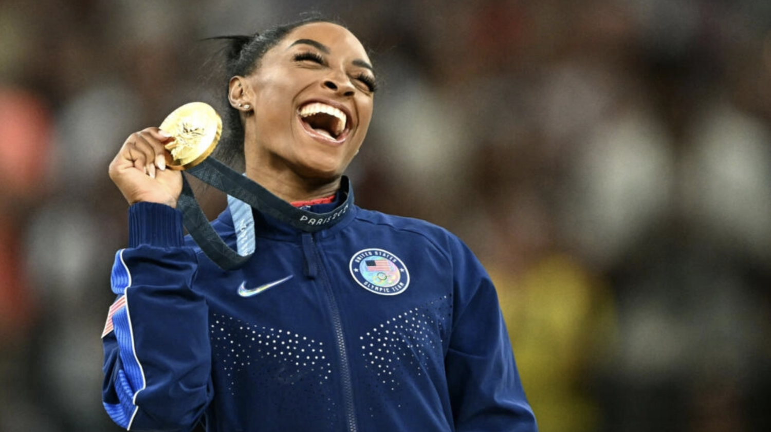 Gold medallist US' Simone Biles celebrates during the podium ceremony for the artistic gymnastics women's vault during the Paris 2024 Olympic Games at the Bercy Arena in Paris, on August 3, 2024. © Lionel Bonaventure, AFP