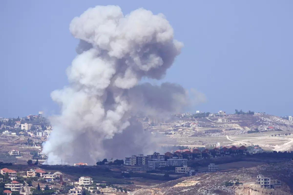 Smoke from Israeli airstrikes on villages in the Nabatiyeh district is visible Monday from the southern town of Marjayoun, Lebanon.   (Hussein Malla / Associated Press)