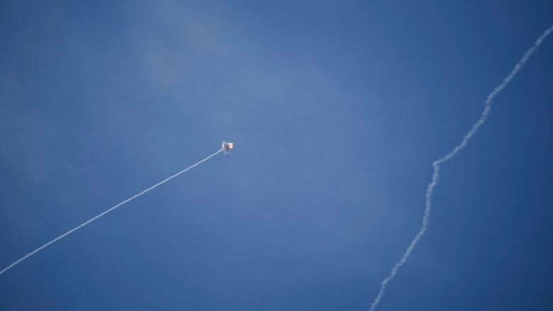 Israel's Iron Dome air defence system fires to intercept a rocket fired from Lebanon, in northern Israel on Friday. (Leo Correa/The Associated Press)