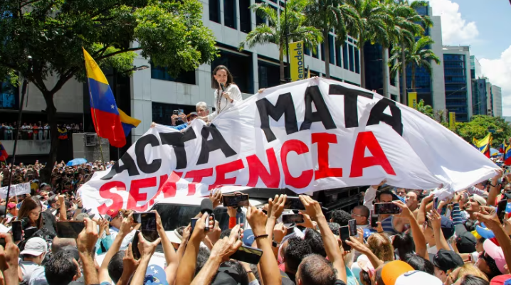 Opposition leader Maria Corina Machado leads a protest against the reelection of President Nicolás Maduro one month after the disputed presidential vote in Caracas, Venezuela on Wednesday, Aug. 28, 2024. (Ariana Cubillos/Associated Press)