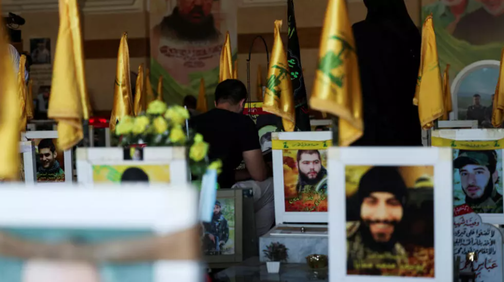 People pray at a cemetery dedicated to Lebanese Hezbollah fighters in Ghobeiry, the southern suburbs of Beirut, on September 19, 2024. © Emilie Madi, Reuters