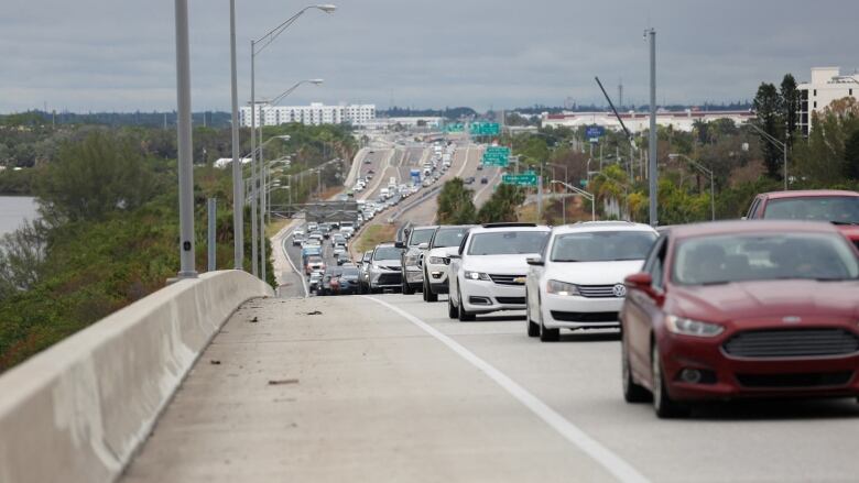 Heavy traffic begins to back up on Interstate 275 South as residents evacuate St. Petersburg, Fla., ahead of Hurricane Milton, on Monday. (Octavio Jones/Reuters)