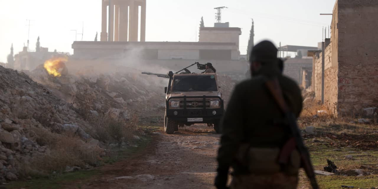 Rebel fighters fired toward Syrian army troops Friday on the outskirts of Aleppo. bakr alkasem/Agence France-Presse/Getty Images