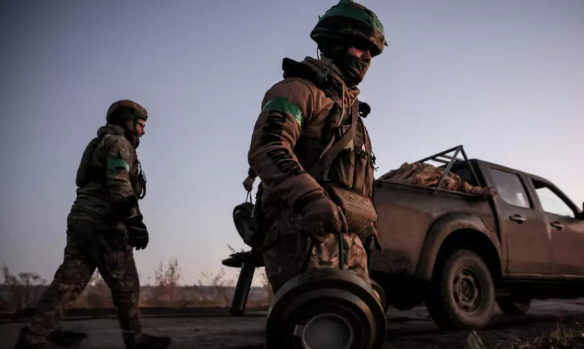 This handout photograph taken and released by the Press service of the 24th mechanized brigade named after King Danylo of the Armed Forces of Ukraine on October 30, 2024 shows engineers of the brigade during the installation of anti-tank landmines along t