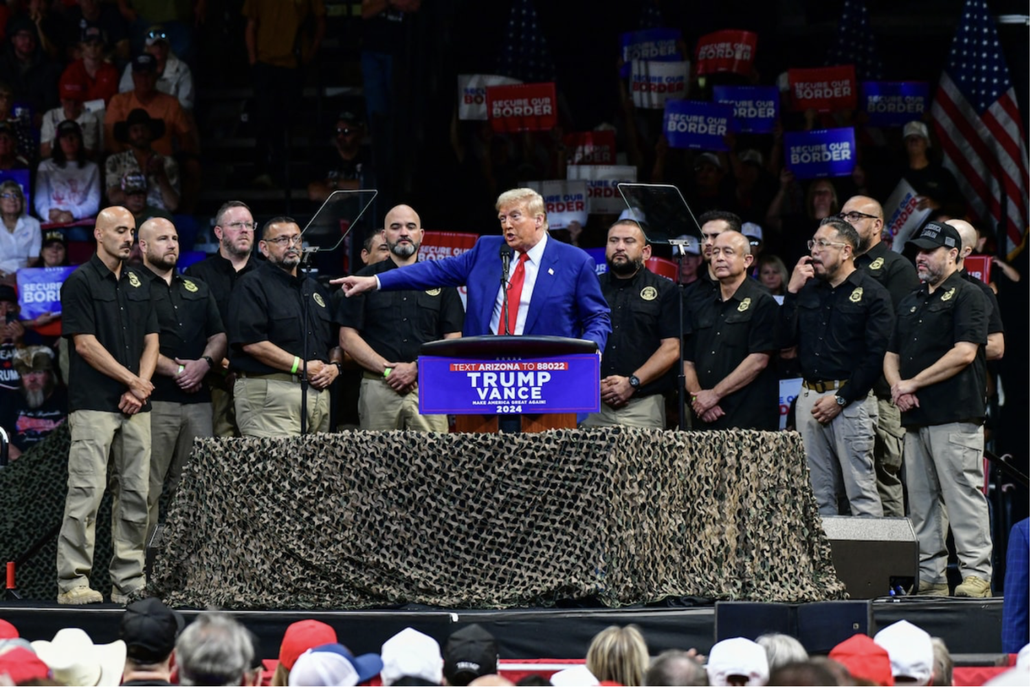 Donald Trump at an October campaign rally in Prescott Valley, Arizona, alongside National Border Patrol Union members. (Caitlin O'hara/AFP/Getty Images)