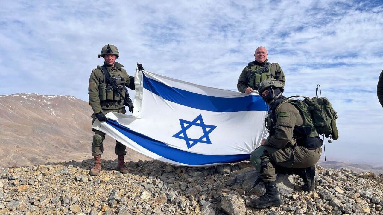 Israeli soldiers stand on Mount Hermon, in Syria, after Prime Minister Benjamin Netanyahu ordered the military to retake a demilitarized zone. Social Media