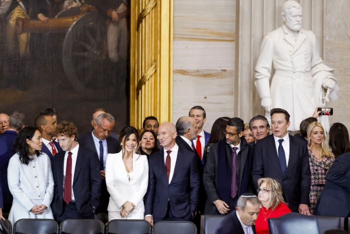 Priscilla Chan, Meta CEO Mark Zuckerberg, Lauren Sanchez, Amazon founder Jeff Bezos, Google CEO Sundar Pichai and Tesla CEO Elon Musk stood at Monday’s inauguration event. PHOTO: SHAWN THEW/PRESS POOL