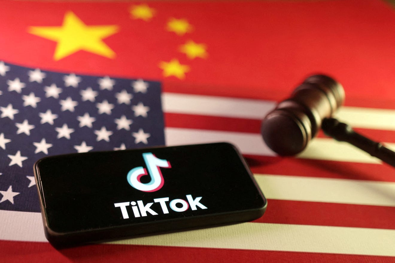 U.S., Chinese flags, TikTok logo and gavel are seen in this illustration taken January 8, 2025. Dado Ruvic, REUTERS