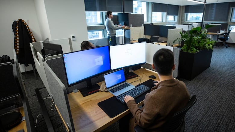 Amazon workers in the Vancouver office in March 2024. Staff were allowed to work a hybrid schedule, but as of Jan. 2, that in-office requirement for the company's global workforce changed to five days per week. (Ben Nelms/CBC)