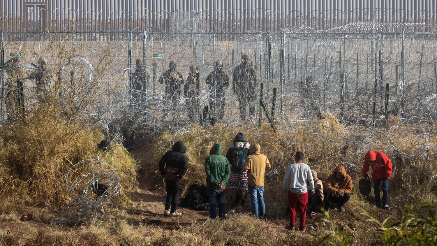 Migrants near the Rio Grande along the US-Mexico border in Juarez, Chihuahua state, Mexico, on December 18, 2024.  David Peinado/Bloomberg/Getty Images