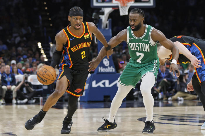 Thunder guard Shai Gilgeous-Alexander drives against Celtics guard Jaylen Brown. PHOTO: NATE BILLINGS/ASSOCIATED PRESS