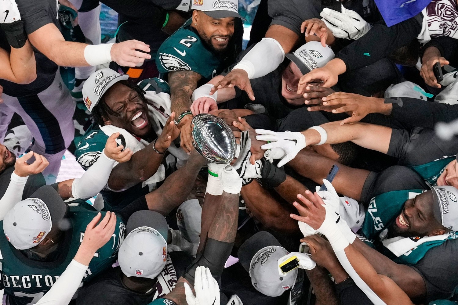 The Philadelphia Eagles celebrate with the Lombardi Trophy after winning Super Bowl LIX on Sunday, February 9. David J. Phillip/AP