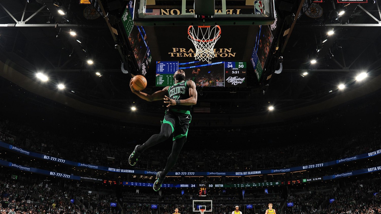 Jaylen Brown of the Boston Celtics dunks during the game against the Indiana Pacers.  Brian Babineau/NBAE/Getty Images