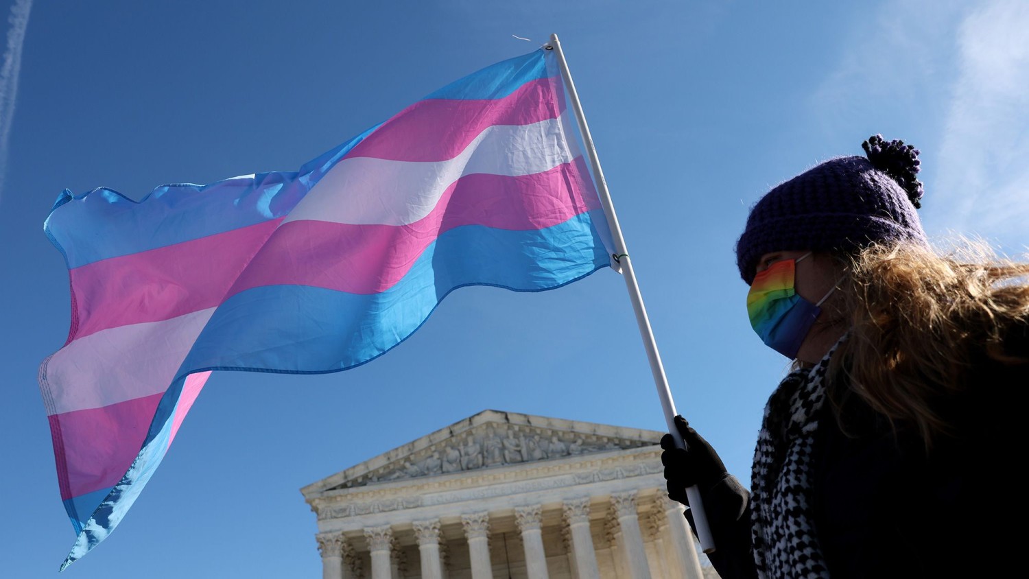 A transgender rights supporter takes part in a rally outside of the US Supreme Court as the high court hears arguments in a case on transgender health rights on December 4, 2024 in Washington, DC. Kevin Dietsch/Getty Images