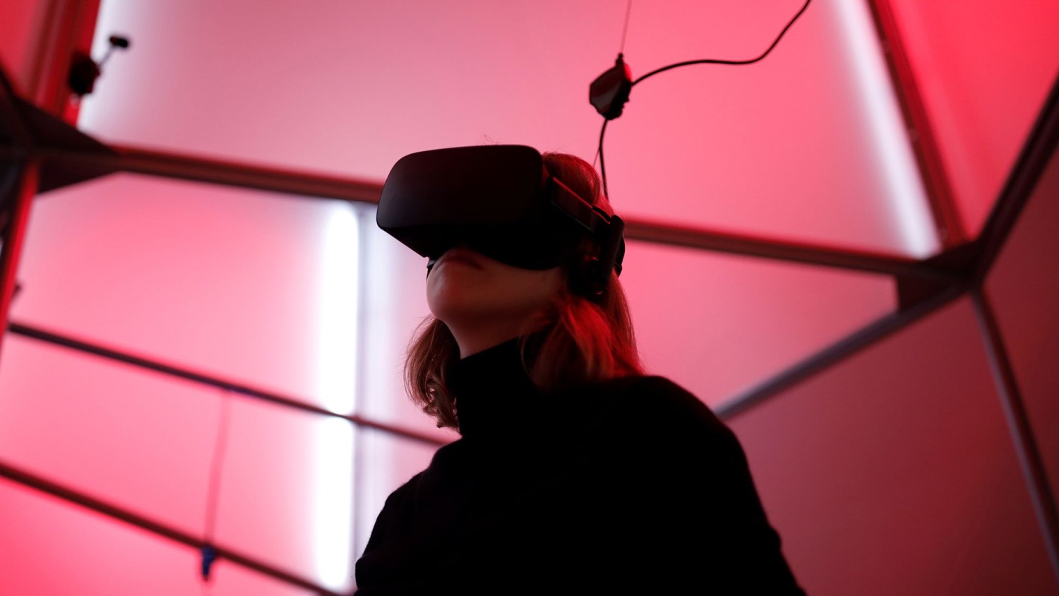 A woman plays a video game with the Oculus Rift VR headset at a video arcade dedicated to virtual reality in Paris, France on December 5, 2016.  Benoit Tessier/Reuters