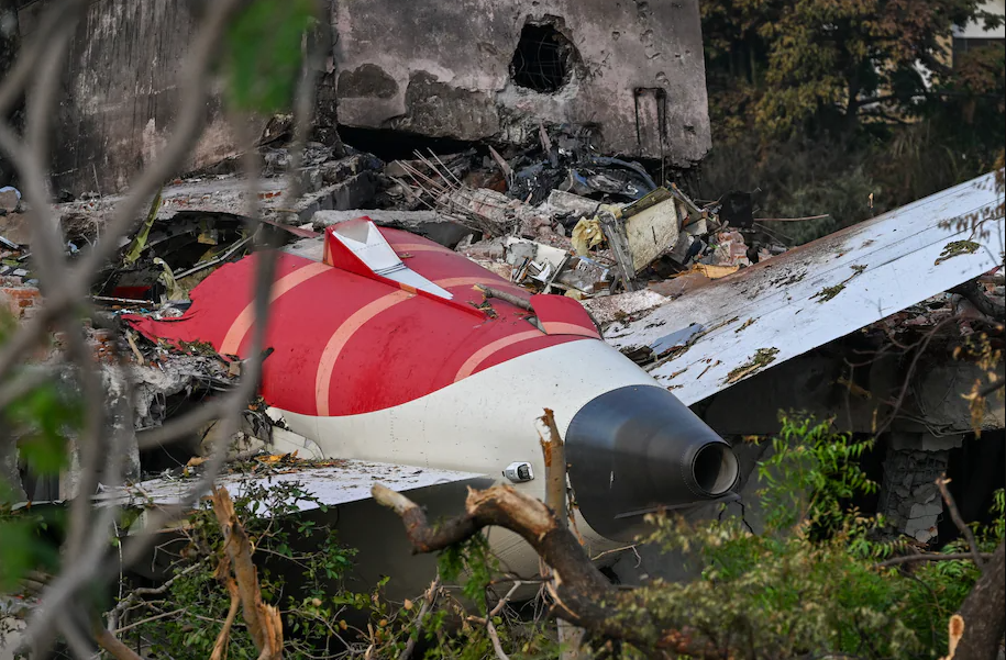 The tail section of the Air India Boeing 787-8 in a residential area near the airport in Ahmedabad on June 14, 2025. (Punit Paranjpe/AFP/Getty Images)