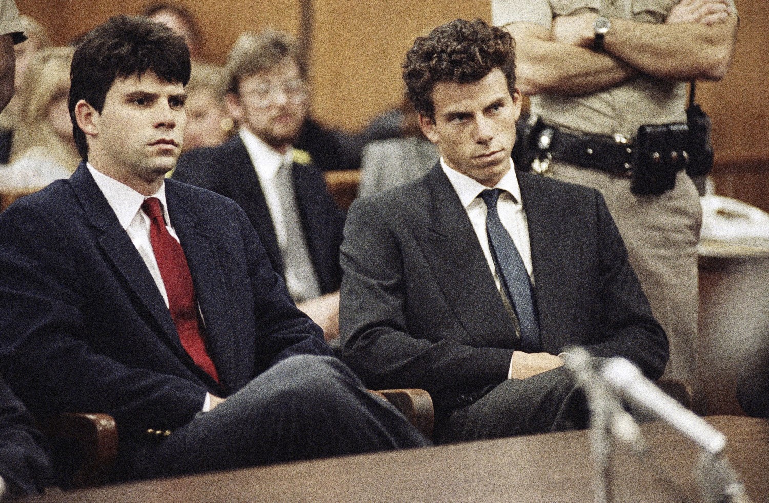 Lyle Menendez, left, and his brother, Erik, sit in Beverly Hills Municipal Court in Beverly Hills, California, on March 12, 1990. Nick Ut/AP