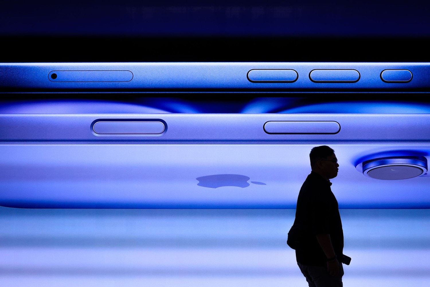 A man walks past a screen displaying the iPhone 16 inside the Apple Inc. store at Tun Razak Exchange (TRX) on September 20, 2024, in Kuala Lumpur, Malaysia. Annice Lyn/Getty Images