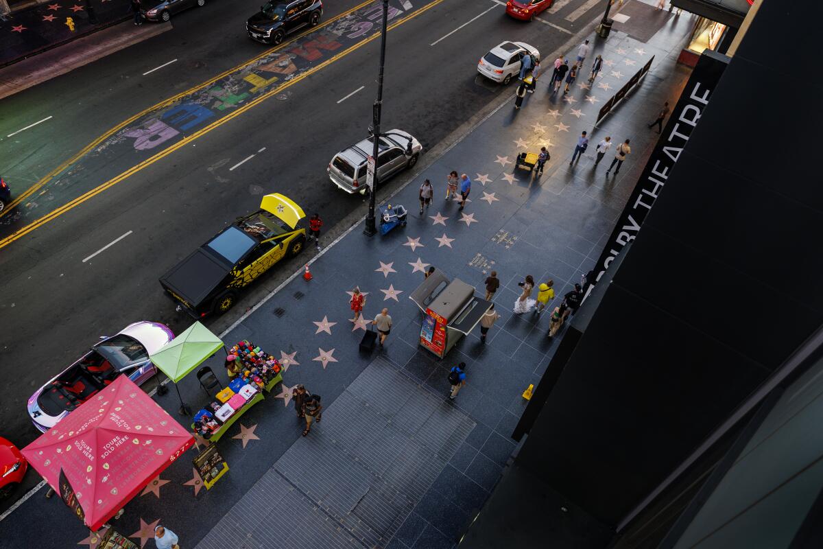Tourists walk along Hollywood Boulevard in front of the Dolby Theater in L.A.   (Gina Ferazzi/Los Angeles Times)