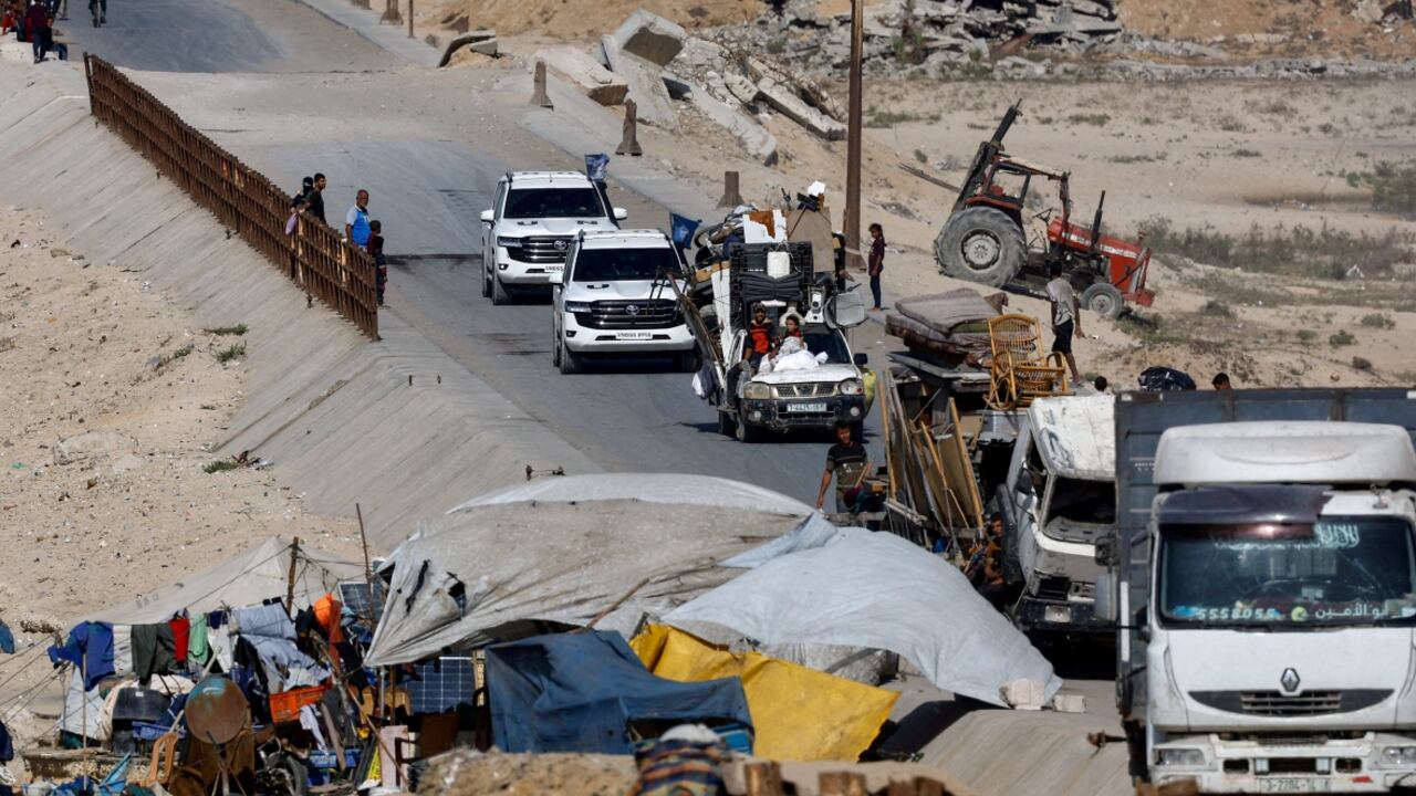 United Nations vehicles drive on a road as displaced Palestinians, fleeing northern Gaza due to an Israeli military operation, move southwards on Friday. (Mahmoud Issa/Reuters)
