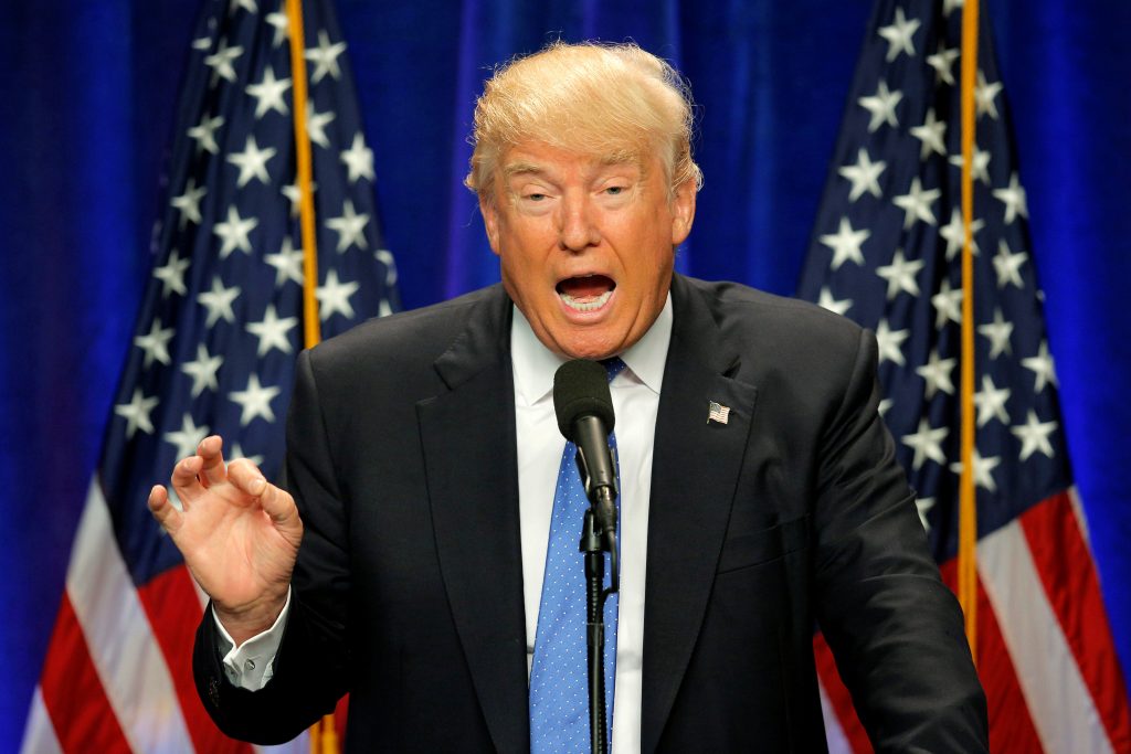 Left: Republican presidential candidate Donald Trump delivers a campaign speech about national security in Manchester, New Hampshire. Photo by Brian Snyder/Reuters