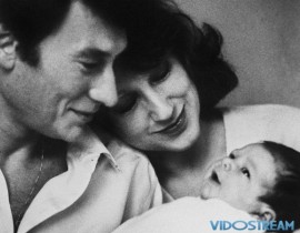 The French rocker married five times, including twice with the same woman. This picture shows him posing with his second wife, actress Nathalie Baye, and their newly born daughter Laura in December 1983.